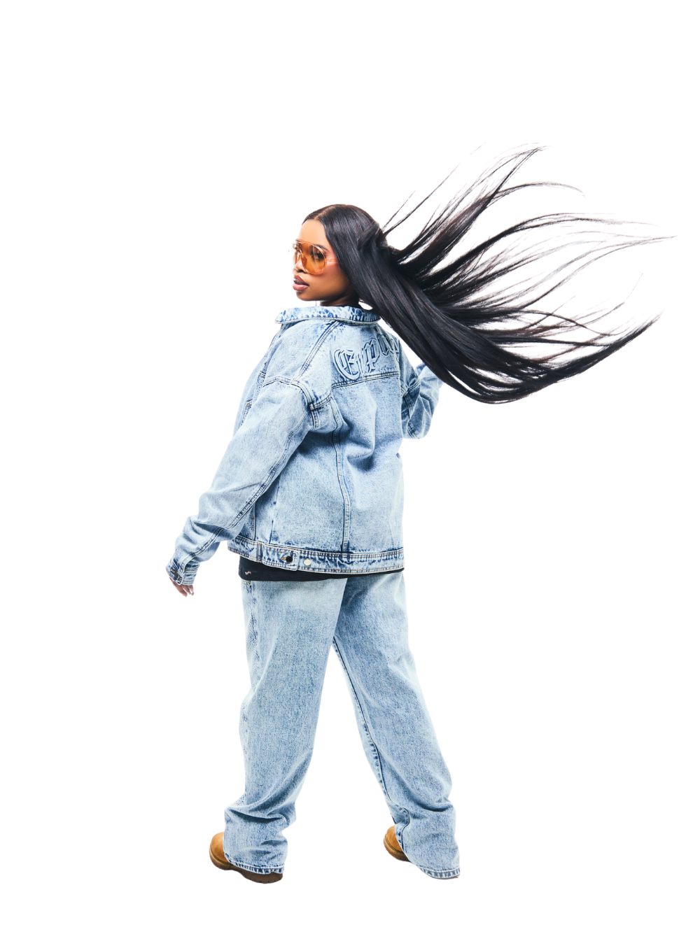 Empire blue denim jeanes at unseen grail. local brands south africa. streetwear. men and women. studio image female model full back view denim