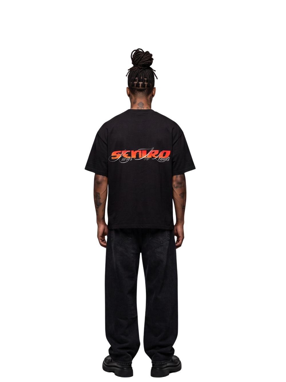 seniro black oversized graphic tshirt at unseen grail. local brands south africa. streetwear. men and women. studio image male model behind full outfit
