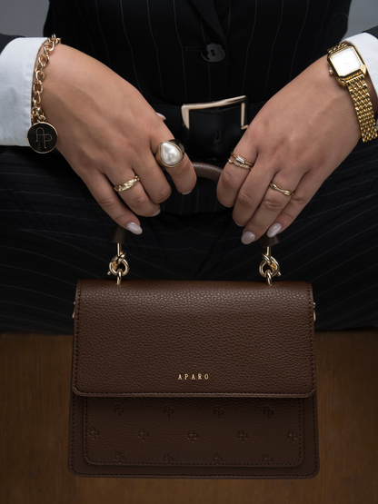 Aparo womens handbag. brown bag. local brand at Unseen Grail. superbalist. close up on model in hand