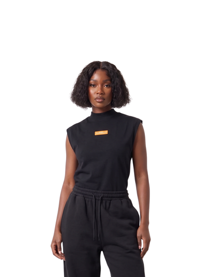 Auriello black oversized graphic vest at unseen grail. local brands south africa. streetwear. men and women. studio image female model front