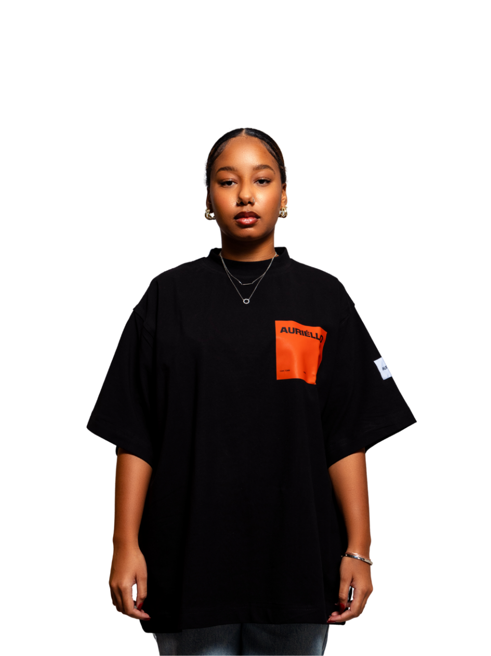 Auriello black oversized graphic vest at unseen grail. local brands south africa. streetwear. men and women. studio image female model orange pocket