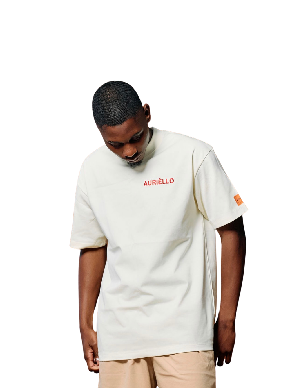 Auriello cream oversized graphic vest at unseen grail. local brands south africa. streetwear. men and women. studio image male model front looking down