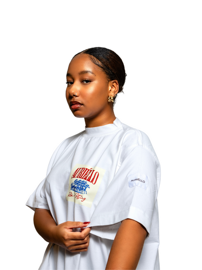 Auriello white cowboy oversized graphic vest at unseen grail. local brands south africa. streetwear. men and women. studio image female model close up