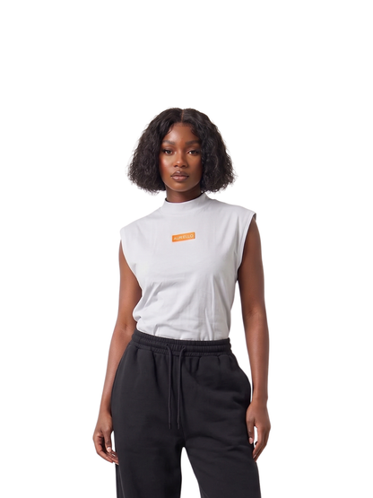 Auriello white oversized graphic vest at unseen grail. local brands south africa. streetwear. men and women. studio image female model front