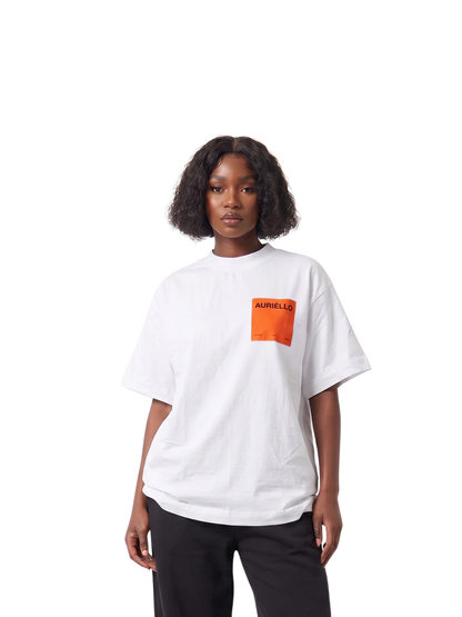 Auriello white oversized graphic vest at unseen grail. local brands south africa. streetwear. men and women. studio image orange pocket female model standing
