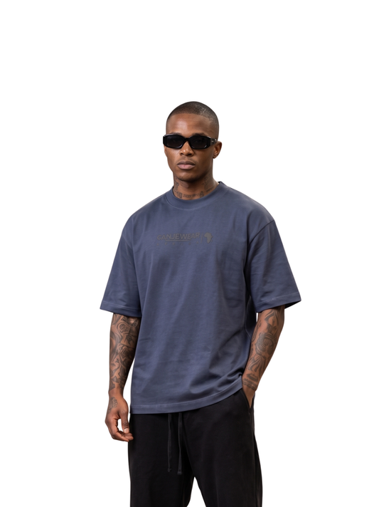 Cancel wear blue oversized graphic t shirt at unseen grail. local brands south africa. streetwear. men and women. studio image male model. galxboy. bantu.
