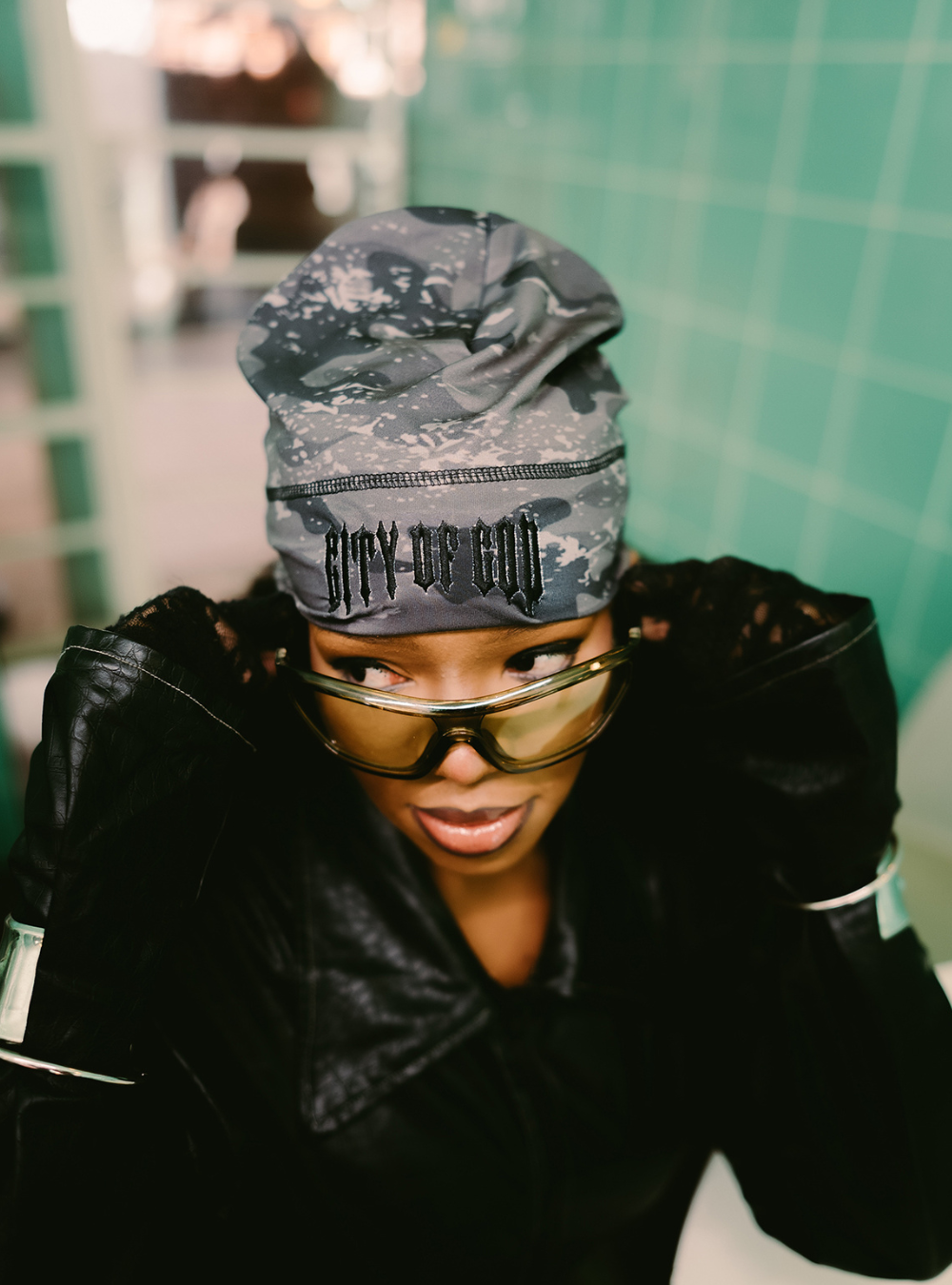 City of Gods black skull caps. local brands from south africa found at Unseen Grail. men and women. close up front female model
