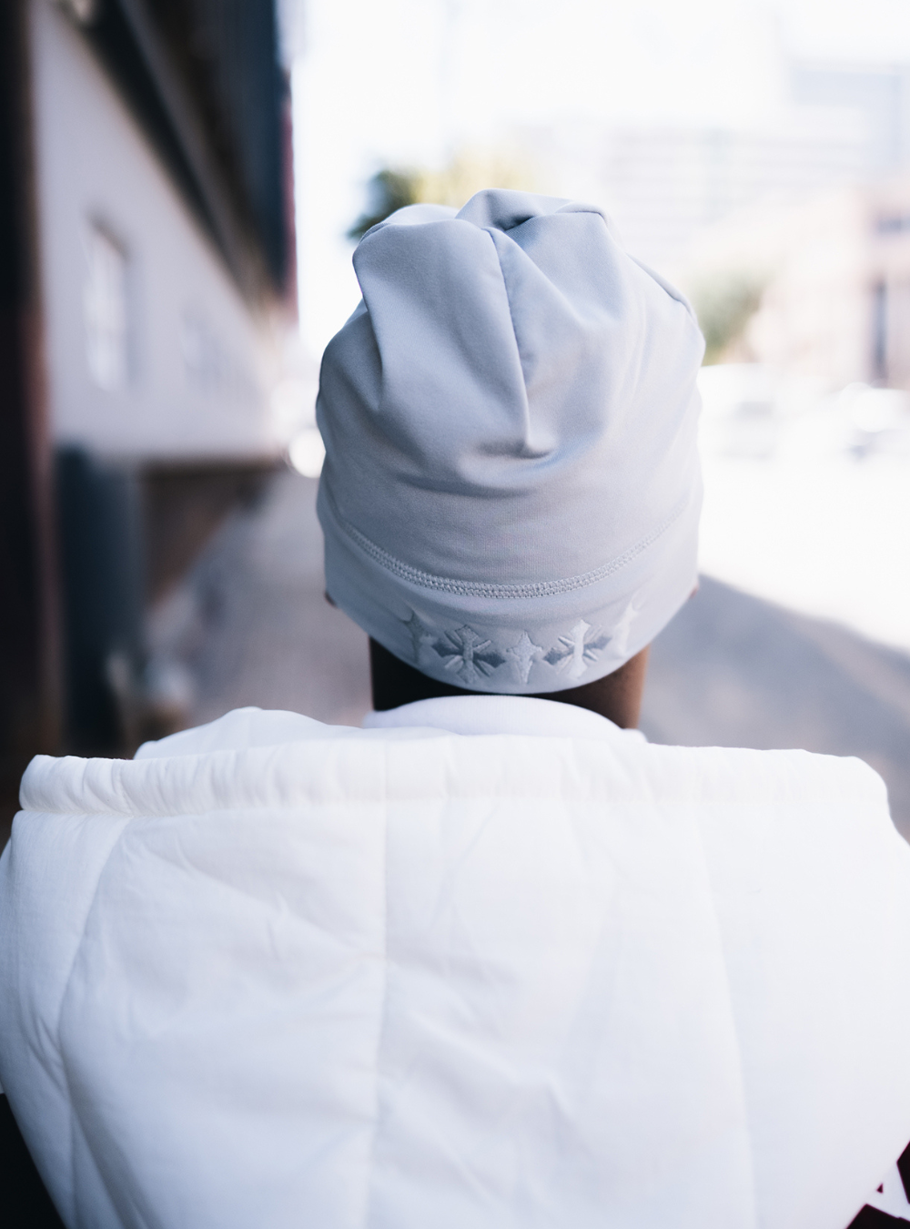 City of Gods grey skull caps. local brands from south africa found at Unseen Grail. men and women. close up back male model
