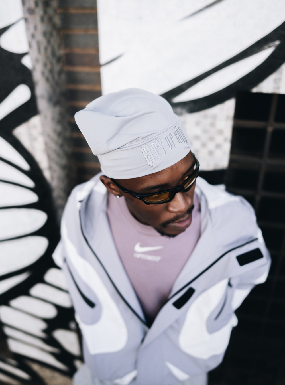 City of Gods grey skull caps. local brands from south africa found at Unseen Grail. men and women. close up side front male model