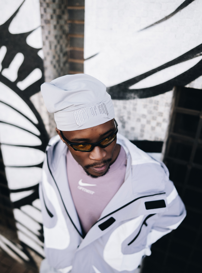 City of Gods grey skull caps. local brands from south africa found at Unseen Grail. men and women. close up side front male model 1