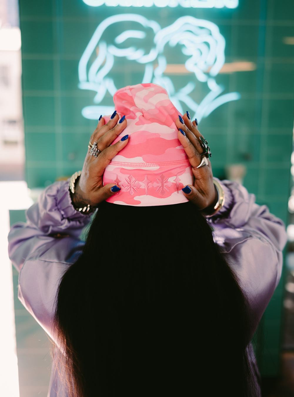 City of Gods pink camo skull caps. local brands from south africa found at Unseen Grail. men and women. female model from back 1