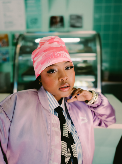 City of Gods pink camo skull caps. local brands from south africa found at Unseen Grail. men and women. female model from front