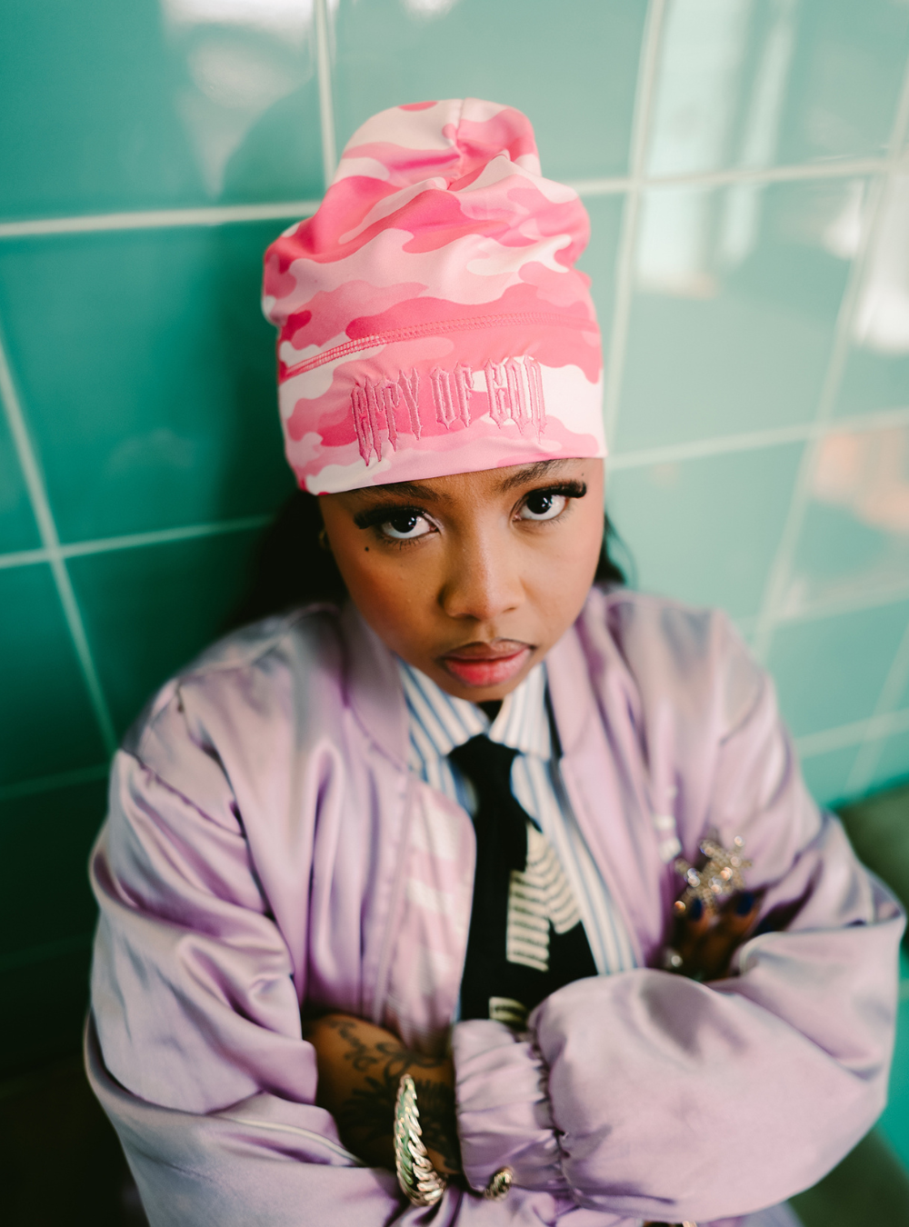 City of Gods pink camo skull caps. local brands from south africa found at Unseen Grail. men and women. female model front 1 eyes