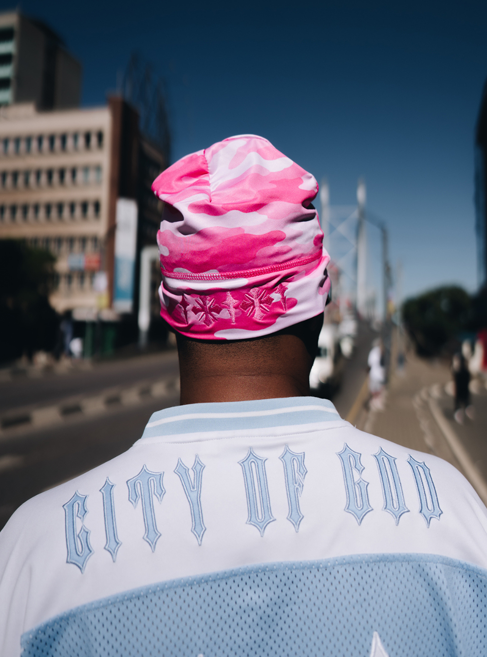 City of Gods pink camo skull caps. local brands from south africa found at Unseen Grail. men and women. male model from back
