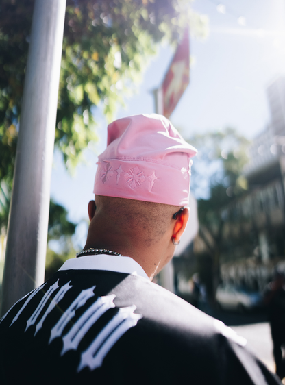 City of Gods pink skull caps. local brands from south africa found at Unseen Grail. men and women. close up front male from back