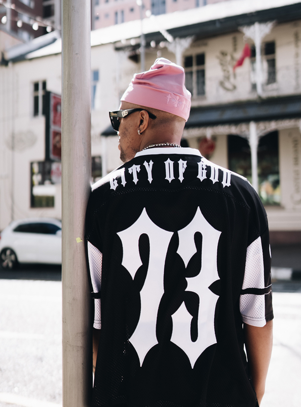 City of Gods pink skull caps. local brands from south africa found at Unseen Grail. men and women. male model from back