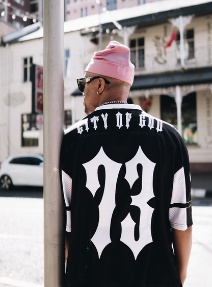 City of Gods pink skull caps. local brands from south africa found at Unseen Grail. men and women. male model from back