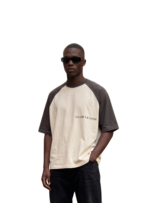 Club Le Don cream oversized graphic t shirt at unseen grail. local brands south africa. streetwear. men and women. studio image male model front
