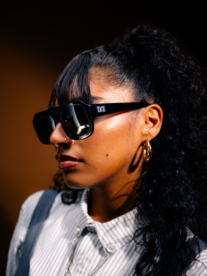 Dimas black frame black lense Eyewear unisex sunglasses collection modern fashion frames South African eyewear brand 1 studio image female model