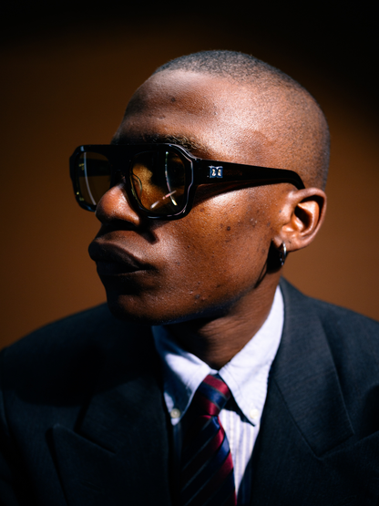 Dimas brown frame yellow lenses Eyewear unisex sunglasses collection modern fashion frames South African eyewear brand. studio image 1 male model