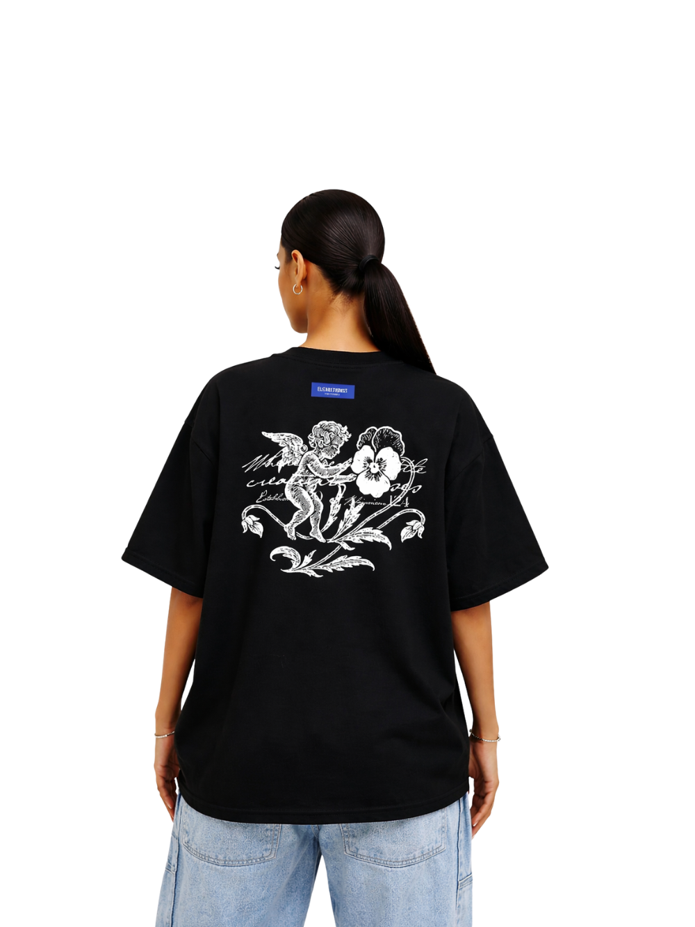 Elizabeth Dust black oversized graphic t shirt at unseen grail. local brands south africa. streetwear. men and women. studio image female model behind