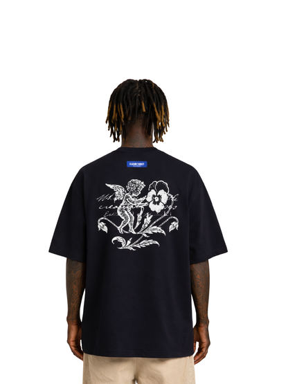 Elizabeth Dust black oversized graphic t shirt at unseen grail. local brands south africa. streetwear. men and women. studio image male model behind.