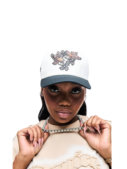 Empire adjustable cap  at unseen grail. local brands south africa. streetwear. men and women. studio image cream cap back close up female model