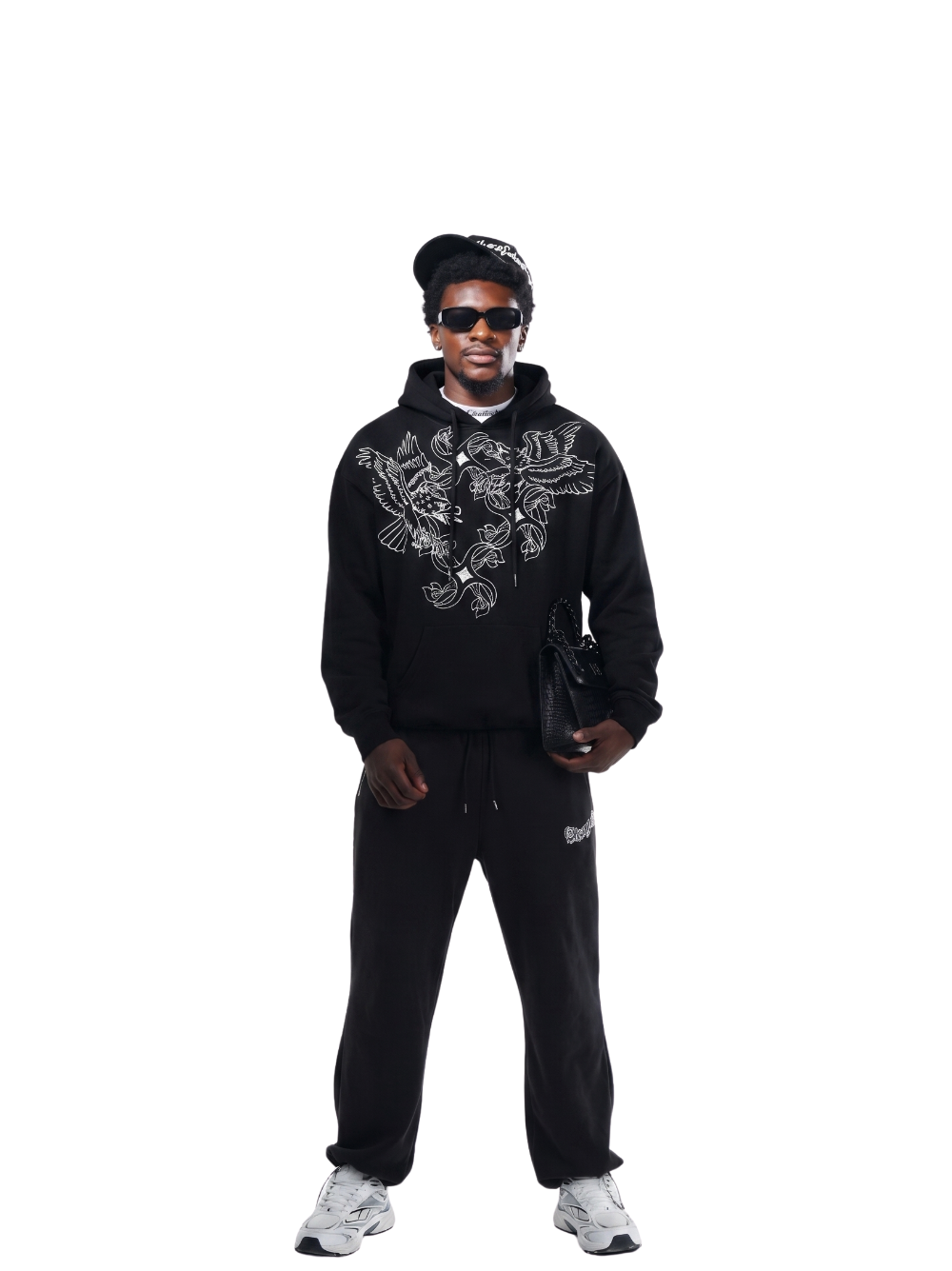 Empire black oversized graphic hoodie at unseen grail. local brands south africa. streetwear. men and women. studio image behind male model full outfit