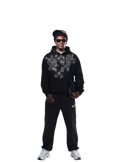 Empire black oversized graphic hoodie at unseen grail. local brands south africa. streetwear. men and women. studio image behind male model full outfit