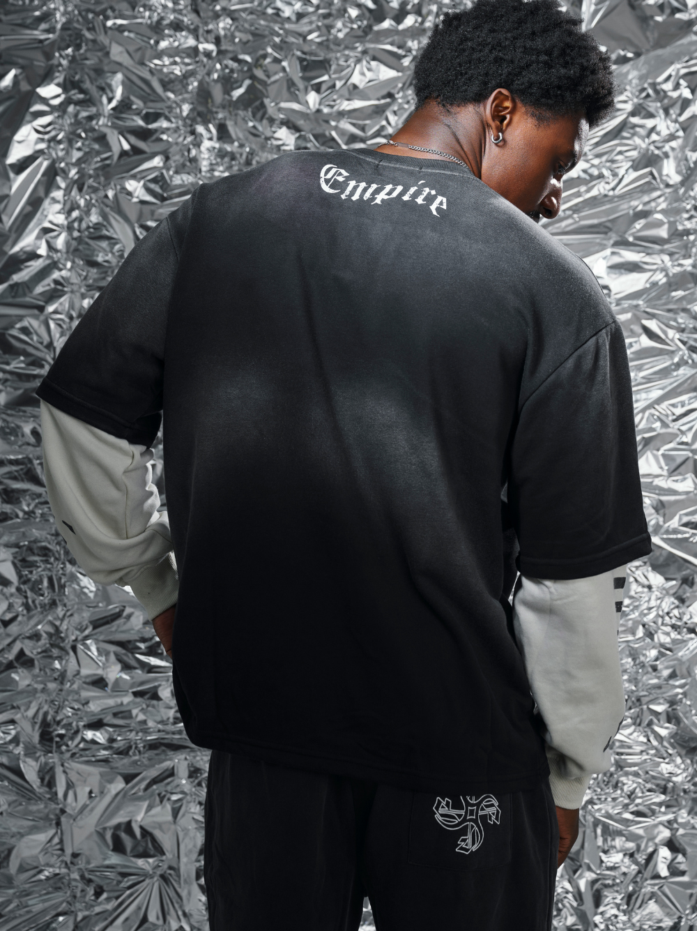 Empire black oversized graphic long sleeve shirt at unseen grail. local brands south africa. streetwear. men and women. studio image close up behind male model