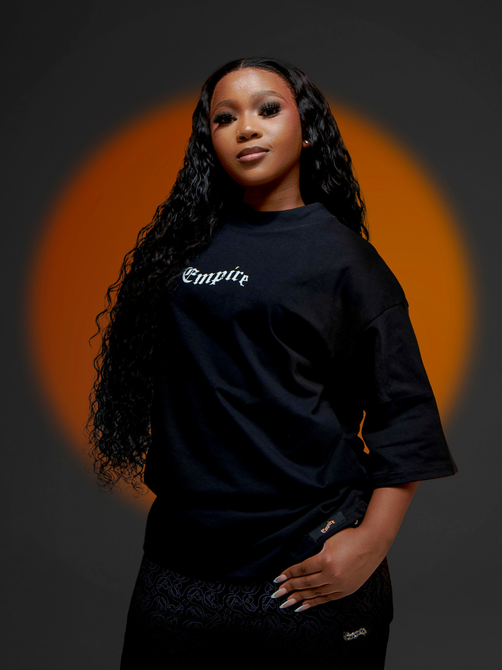 Empire black oversized graphic t shirt at unseen grail. local brands south africa. streetwear. men and women. studio image male model front view