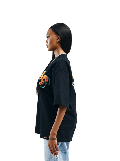 Empire black oversized graphic white tshirt at unseen grail. local brands south africa. streetwear. men and women. studio image women side view