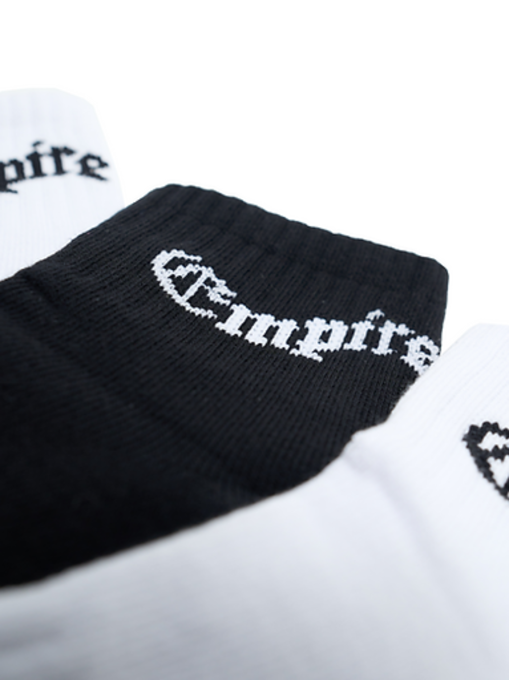 Empire black socks at unseen grail. local brands south africa. streetwear. men and women. studio image socks close up