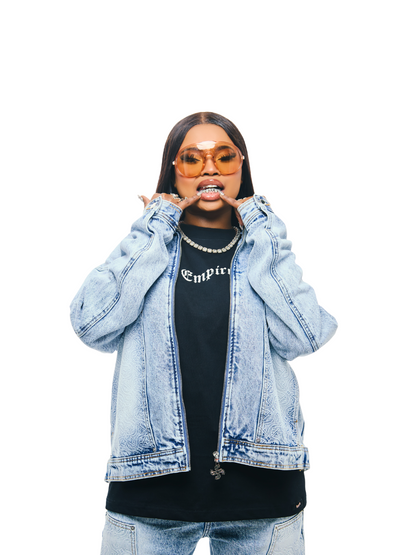 Empire blue denim jacket at unseen grail. local brands south africa. streetwear. men and women. studio image female model front view