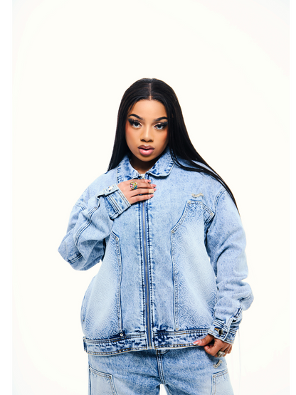 Empire blue denim jacket at unseen grail. local brands south africa. streetwear. men and women. studio image female model front view jacket