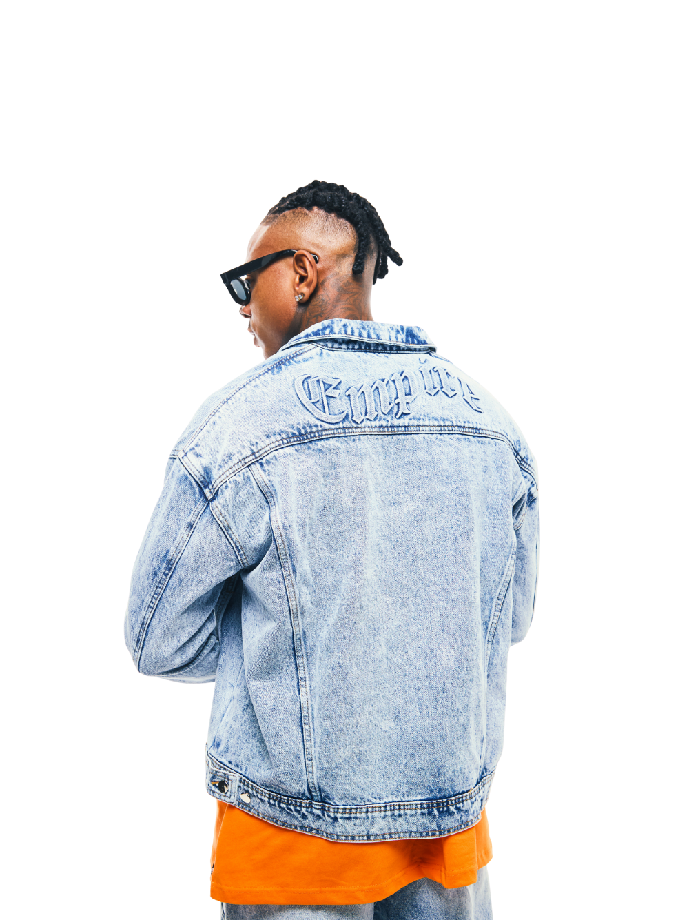 Empire blue denim jacket at unseen grail. local brands south africa. streetwear. men and women. studio image male model back view