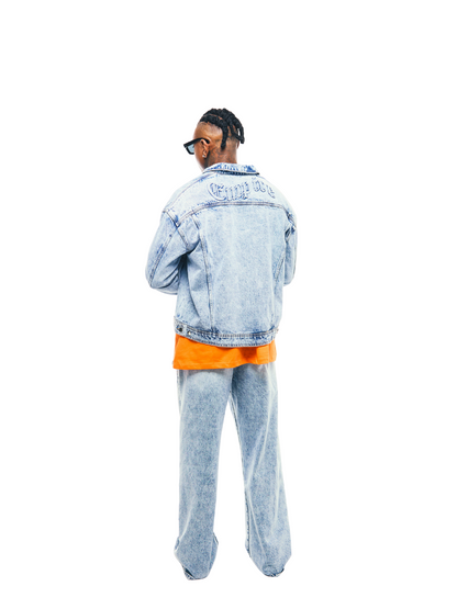 Empire blue denim jeanes at unseen grail. local brands south africa. streetwear. men and women. studio image male model full back view denim