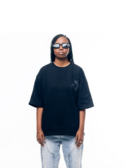 Empire graphic oversized tshirt black at unseen grail. local brands south africa. streetwear. men and women. studio image female model front