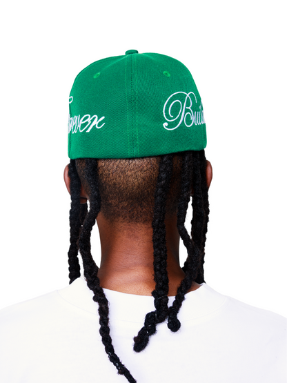 Empire green fitted cap at unseen grail. local brands south africa. streetwear. men and women. studio image male model back view