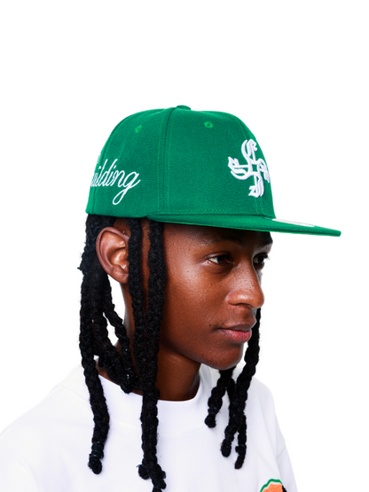 Empire green fitted cap at unseen grail. local brands south africa. streetwear. men and women. studio image male model front side