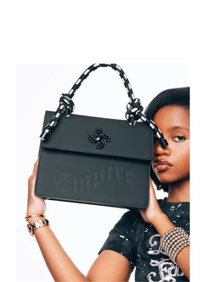Empire handbag at unseen grail. local brands south africa. streetwear. men and women. female model studio