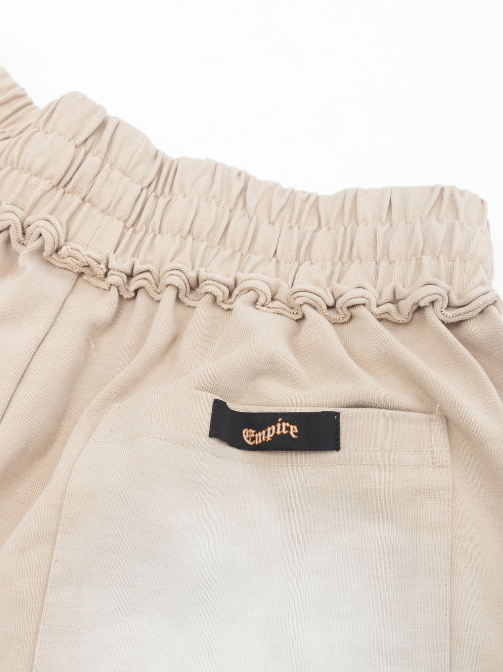Empire heavyweight shorts cream at unseen grail. local brands south africa. streetwear. men and women. studio image close up 1