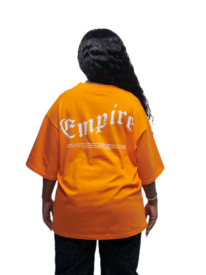 Empire orange oversized graphic t shirt at unseen grail. local brands south africa. streetwear. men and women. studio image female model close up back view
