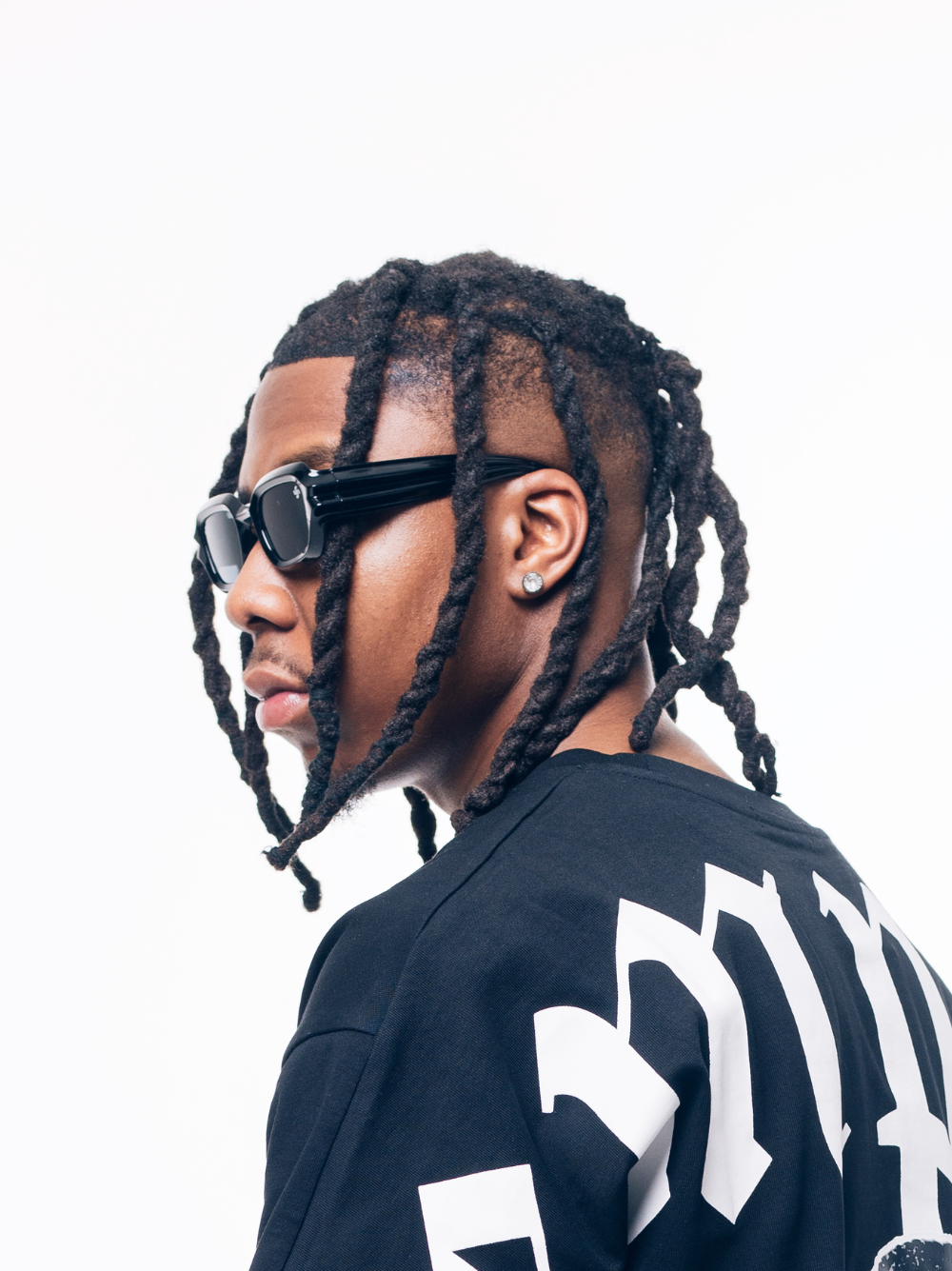 Empire sunglasses black at unseen grail. local brands south africa. streetwear. men and women. studio image male model side view
