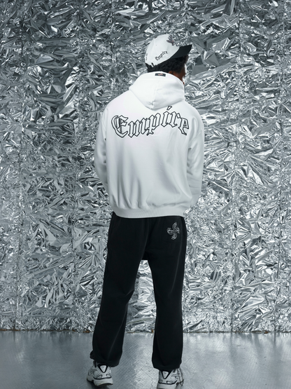 Empire white oversized graphic hoodie at unseen grail. local brands south africa. streetwear. men and women. studio image close up front male model standing