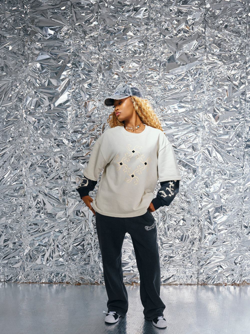 Empire white oversized graphic long sleeve shirt at unseen grail. local brands south africa. streetwear. men and women. studio image female model full outfit
