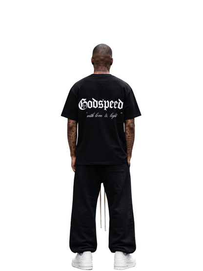 Godspeed black oversized graphic t shirt at unseen grail. local brands south africa. streetwear. men and women. studio image behind male model full outfit. galxboy, bantu, boys of soweto