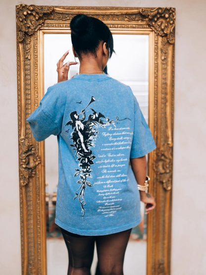 Godspeed blue oversized graphic t shirt at unseen grail. local brands south africa. streetwear. men and women. studio image behind female. galxboy, bantu, adidas