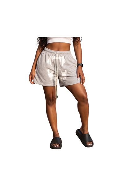 Godspeed grey oversized graphic shorts at unseen grail. local brands south africa. streetwear. men and women. studio image front female model. galxboy, bantu, boys of soweto
