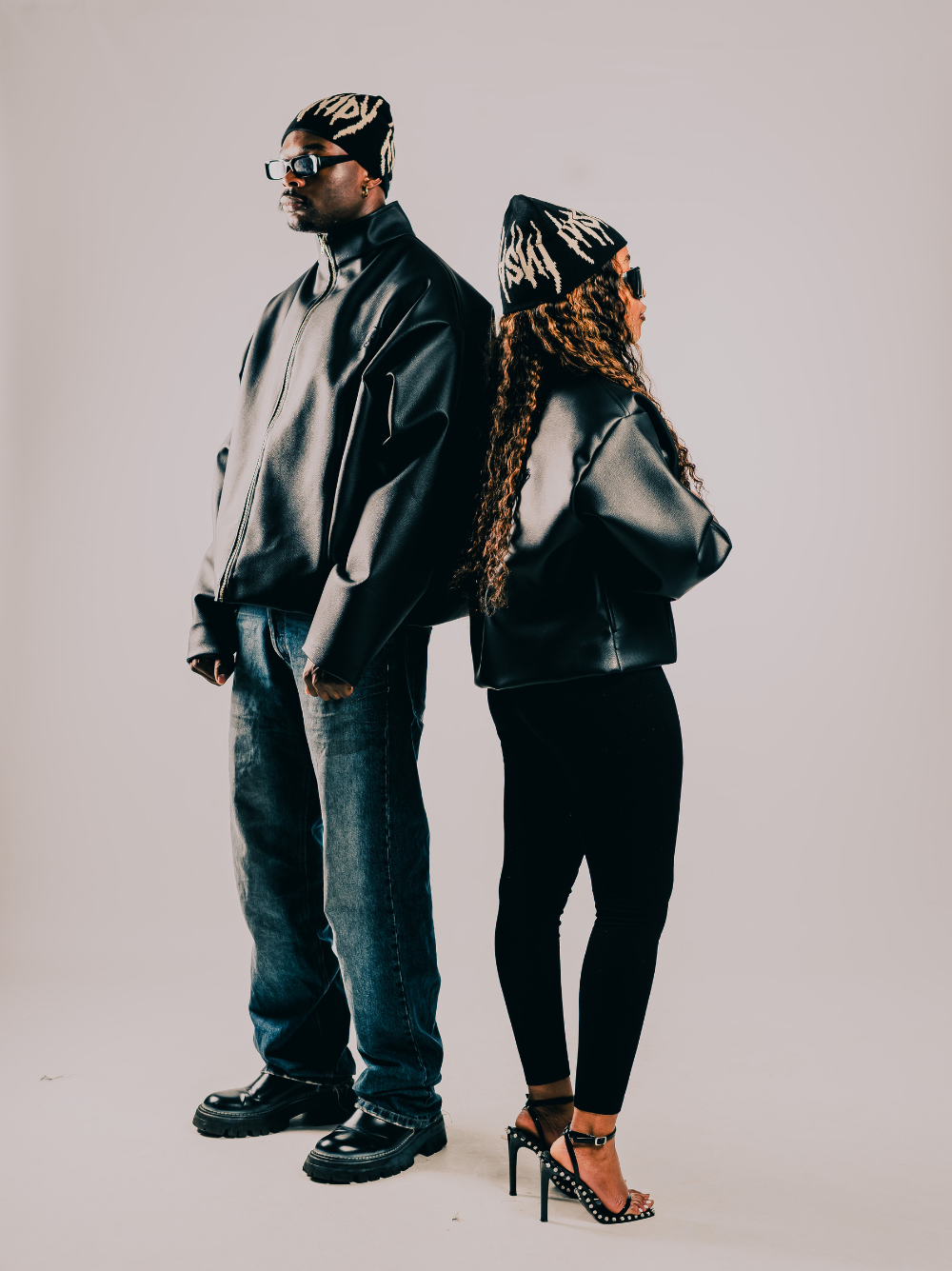Insanidy knitwear black beanie at unseen grail. local brands south africa. streetwear. men and women. studio image male and female model